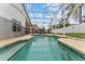 Stunning screened-in pool with expansive patio area, perfect for outdoor relaxation and entertainment at 7905 Golden Pond Cir, Kissimmee, FL 34747
