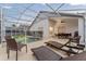 Enjoy the screened-in pool, lounge chairs, and dining area, perfect for outdoor living at 7905 Golden Pond Cir, Kissimmee, FL 34747