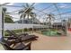 Relax by the screened pool with lounge chairs, ideal for enjoying the backyard oasis at 7905 Golden Pond Cir, Kissimmee, FL 34747