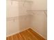 Walk-in closet featuring wire shelving and wood floors at 860 N Orange Ave # 428, Orlando, FL 32801