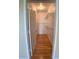 Walk-in closet featuring wire shelving, wood floors, an overhead light, and a door to the hallway at 860 N Orange Ave # 428, Orlando, FL 32801