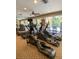 Community gym featuring treadmills, elliptical machines, mirrors, and ceiling fan for a complete workout space at 860 N Orange Ave # 428, Orlando, FL 32801