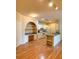 Open floor plan showcasing kitchen with white cabinets, appliances, granite counters and an adjacent built-in desk space at 860 N Orange Ave # 428, Orlando, FL 32801