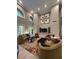 Upscale community living room featuring modern furniture, stylish decor, and high ceilings with large arched windows at 860 N Orange Ave # 428, Orlando, FL 32801
