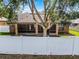 Backyard view featuring a white fence and screened patio at 1007 Golf View Estates Dr, Orange City, FL 32763
