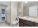 Neutral bathroom featuring a vanity with countertop, toilet, and shower with a curtain at 1007 Golf View Estates Dr, Orange City, FL 32763
