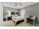 Cozy bedroom with a dark wood bed frame, carpeted floors, and a functional desk and chair setup at 1007 Golf View Estates Dr, Orange City, FL 32763
