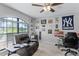 Cozy bedroom with neutral walls, a large window, and Yankee-themed decor at 1007 Golf View Estates Dr, Orange City, FL 32763