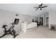 Relaxing bonus room featuring a Peloton exercise bike, a daybed, and a ceiling fan at 1007 Golf View Estates Dr, Orange City, FL 32763