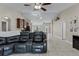 Open floor plan featuring a large sofa and views of the kitchen at 1007 Golf View Estates Dr, Orange City, FL 32763