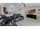 Spacious living room with TV, entertainment center and ample seating at 1007 Golf View Estates Dr, Orange City, FL 32763