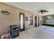Outdoor patio featuring a ceiling fan, string lights, and beverage cooler at 1007 Golf View Estates Dr, Orange City, FL 32763
