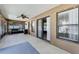 Spacious covered patio with outdoor fan and barbecue grill, perfect for entertaining at 1007 Golf View Estates Dr, Orange City, FL 32763