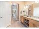 The bathroom features tile floors, a granite countertop, and updated lighting fixtures at 10222 Marsh Pine Cir, Orlando, FL 32832