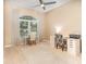 Bright bedroom with a large window, carpet floors, and two desks, perfect for a home office at 10222 Marsh Pine Cir, Orlando, FL 32832