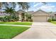Charming home with well-manicured lawn and lush landscaping at 10222 Marsh Pine Cir, Orlando, FL 32832