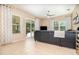 Tile floored living room with access to screened lanai and windows at 10222 Marsh Pine Cir, Orlando, FL 32832