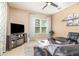 Cozy living room with ceiling fan and tile flooring at 10222 Marsh Pine Cir, Orlando, FL 32832
