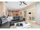 Open concept living room view of the kitchen and screened lanai at 10222 Marsh Pine Cir, Orlando, FL 32832