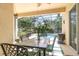 Enjoy outdoor dining on the screened patio with a dining table and chairs overlooking a private pool at 10222 Marsh Pine Cir, Orlando, FL 32832