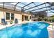 Screened-in pool with lounge chairs and a patio area, perfect for outdoor entertaining and relaxation at 10222 Marsh Pine Cir, Orlando, FL 32832