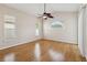 Light-filled bedroom with beautiful hardwood floors and large windows, creating a serene atmosphere at 1024 Featherstone Cir, Ocoee, FL 34761