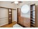 Walk-in closet with adjustable shelving, drawers, and hanging rods at 1024 Featherstone Cir, Ocoee, FL 34761