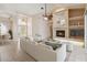 Staged living room featuring tile floors, fireplace, and white furniture creating an inviting atmosphere at 1024 Featherstone Cir, Ocoee, FL 34761