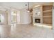 Spacious living room with tile flooring, high ceilings, and a cozy fireplace at 1024 Featherstone Cir, Ocoee, FL 34761