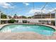 This pool is enclosed and has a white fence surrounding the backyard area at 1024 Featherstone Cir, Ocoee, FL 34761