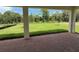 View of the lush backyard from the brick back patio at 1043 Gloryland Ct, Sanford, FL 32771