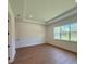 Bright bedroom with hardwood floors, large windows, recessed lights, and a trey ceiling at 1043 Gloryland Ct, Sanford, FL 32771