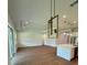Bright living room and kitchen with hardwood floors, recessed lights, and pendant lighting at 1043 Gloryland Ct, Sanford, FL 32771