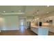 Bright open living room with hardwood floors, recessed lights, and a view to the kitchen at 1043 Gloryland Ct, Sanford, FL 32771