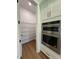 View of the large walk-in pantry with installed wire shelving, accessible from the kitchen at 1043 Gloryland Ct, Sanford, FL 32771