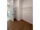 Walk-in closet with wooden floors and wire shelving racks at 1043 Gloryland Ct, Sanford, FL 32771