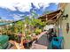 Outdoor backyard space with deck, hot tub, string lights, plants, and chairs at 108 Orion Way, Sanford, FL 32773
