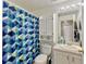 Bathroom featuring patterned shower curtain, vanity with white cabinets, and toilet at 108 Orion Way, Sanford, FL 32773