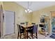 Cozy dining area with table, chairs, tile floor, and sliding glass door to the lanai at 108 Orion Way, Sanford, FL 32773