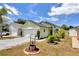 Charming single-story home featuring a well-maintained lawn and a whimsical wishing well accent at 108 Orion Way, Sanford, FL 32773