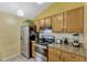 Well-equipped kitchen featuring stainless steel appliances, granite countertops, and ample cabinet space at 108 Orion Way, Sanford, FL 32773