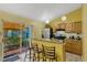 Inviting kitchen featuring granite counters, stainless steel appliances, and bar stool seating at 108 Orion Way, Sanford, FL 32773