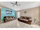 Bright living room featuring tile floors, vaulted ceiling with fan, and comfortable seating at 108 Orion Way, Sanford, FL 32773
