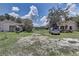Large backyard with ample space for outdoor activities and a detached garage at 11624 Delmar Ave, Orlando, FL 32836