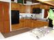 Traditional kitchen with wood cabinets, tiled countertops, and black appliances including oven and microwave at 11624 Delmar Ave, Orlando, FL 32836