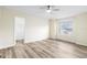 Bedroom featuring neutral paint, modern floors, a ceiling fan, and a window at 12543 Waterhaven Cir, Orlando, FL 32828
