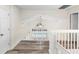 Upstairs hallway overlooking the pool, featuring modern floors and neutral paint at 12543 Waterhaven Cir, Orlando, FL 32828