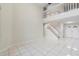 Open-concept living room featuring tile floors, staircase, and high ceilings at 12543 Waterhaven Cir, Orlando, FL 32828