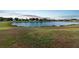 Scenic aerial shot capturing a serene pond surrounded by lush green landscape offering a tranquil community view at 12543 Waterhaven Cir, Orlando, FL 32828