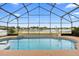 Lovely screened-in pool with a spa and scenic pond views makes a great place for outdoor entertainment at 12543 Waterhaven Cir, Orlando, FL 32828